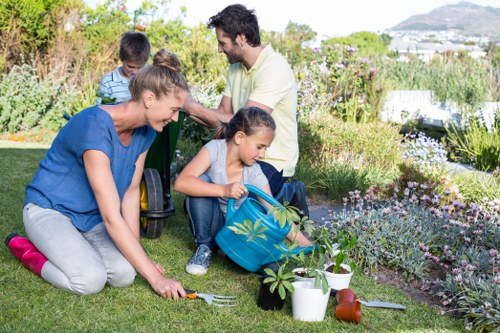 Gardener preparing lawn mower for mowing service